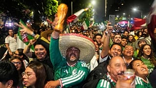 Mexican fans celebrate after beating South Korea during the World Cup Group A match, at the Angel of Independence monument in Mexico City, Thursday, June 18, 2026
