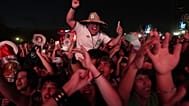 Fans celebrate after Mexico's Luis Romo scored during a World Cup soccer match between Mexico and South Korea at a FIFA Fan Zone in Monterrey,
