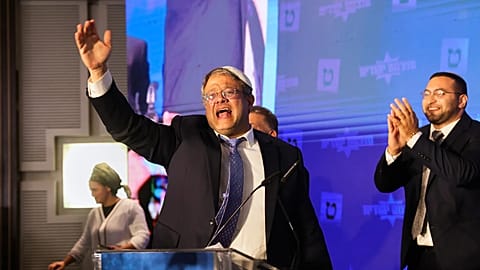  Israeli far-right lawmaker Itamar Ben-Gvir gestures after election exit poll results are released at his party's headquarters in Jerusalem on Nov. 2, 2022.