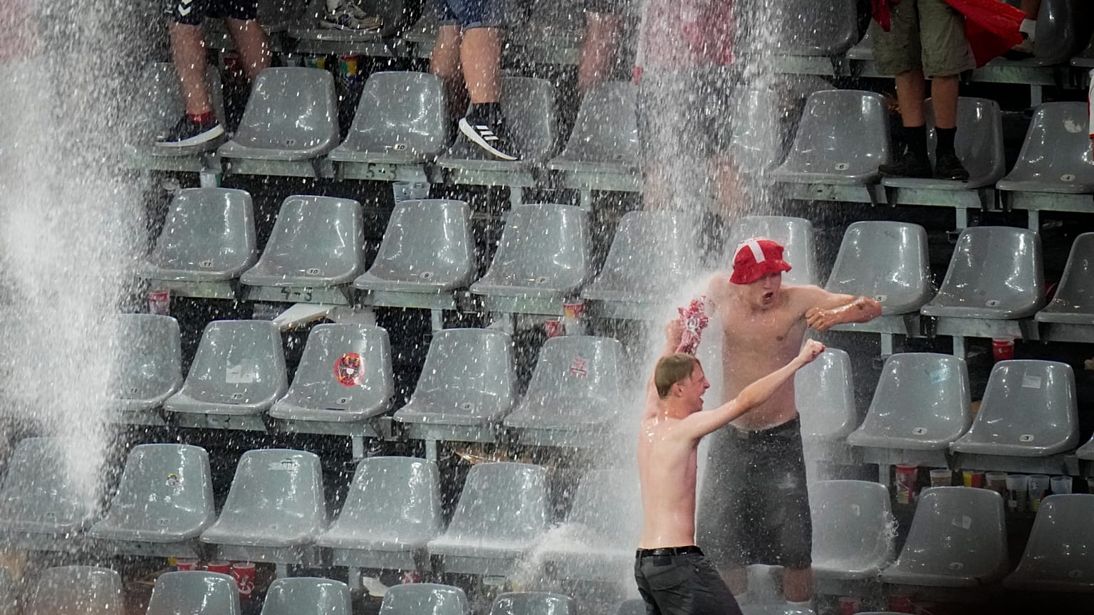 Fans dance in the rain