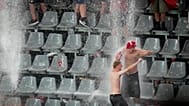 Fans dance in the rain