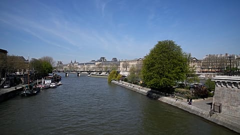 The River Seine flows in Paris, Wednesday, April 5, 2023. A costly and complex clean-up is resuscitating the River Seine just in time for it to play a starring role in the 202