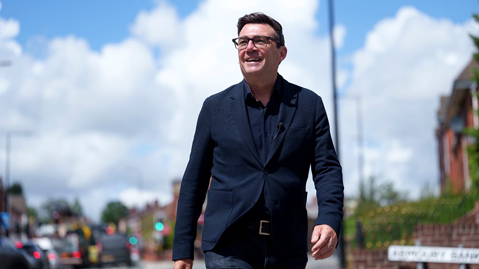 FILE - Andy Burnham smiles during a campaign visit to Ashton-in-Makerfield before the forthcoming by-election, in Manchester, England