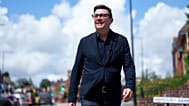 FILE - Andy Burnham smiles during a campaign visit to Ashton-in-Makerfield before the forthcoming by-election, in Manchester, England