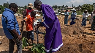 Red Cross in DRC workers bury six-month-old girl who died of Ebola 