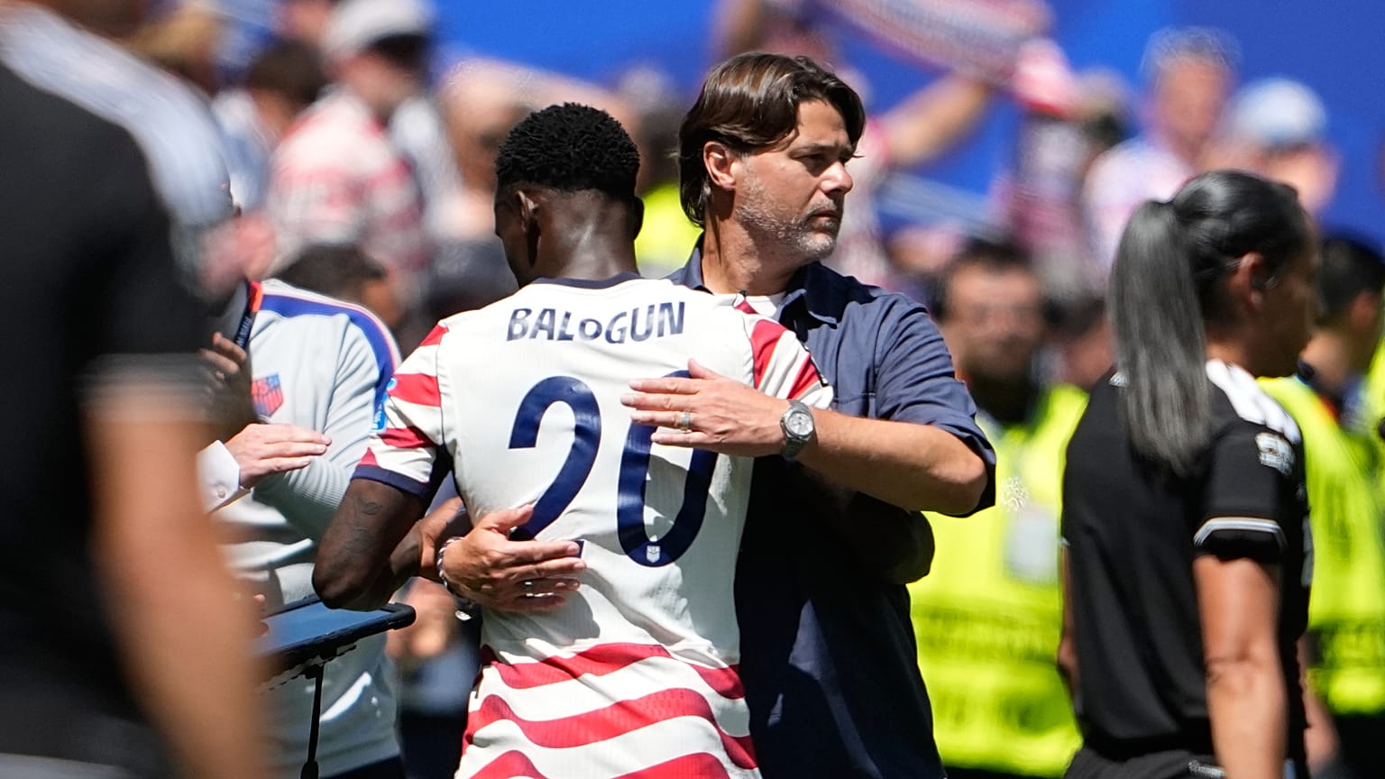 United States head coach Mauricio Pochettino embraces United States' Folarin Balogun after he was substituted during the World Cup Group D match.