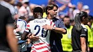United States head coach Mauricio Pochettino embraces United States' Folarin Balogun after he was substituted during the World Cup Group D match.