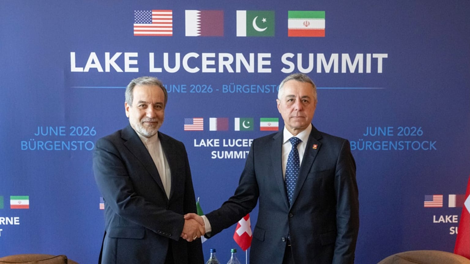 Iran’s Foreign Minister Abbas Araghchi and Swiss counterpart Ignazio Cassis shake hands at bilateral discussions near Lucerne, Switzerland, Sunday, June 21, 2026