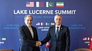 Iran’s Foreign Minister Abbas Araghchi and Swiss counterpart Ignazio Cassis shake hands at bilateral discussions near Lucerne, Switzerland, Sunday, June 21, 2026