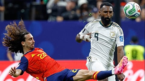 Spain's Marc Cucurella and Saudi Arabia's Feras Albrikan vie for the ball during the World Cup Group H match in Atlanta, Sunday, June 21, 2026