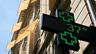 A sign outside a pharmacy displays a temperature of 37 degrees Celsius (98.6 degrees Fahrenheit) in Paris, Sunday, June 21, 2026. 