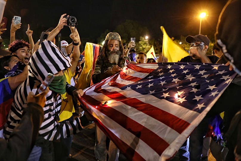 Supporters of presidential candidate Iván Cepeda burn a US flag after election results showed him trailing in the runoff election in Cali, Colombia, Sunday, June 21, 2026.