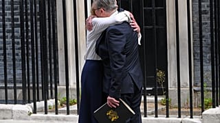 Britain's Prime Minister Keir Starmer hugs his wife Victoria after he announced his resignation outside 10 Downing Street in London, Monday, June 22, 2026