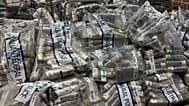 In this undated photo provided by the Australian Federal Police, a quantity of cocaine is bagged and displayed in Sydney