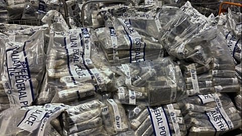 In this undated photo provided by the Australian Federal Police, a quantity of cocaine is bagged and displayed in Sydney