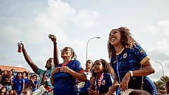 Fans react as they watch a broadcast of the World Cup Group H soccer match between Cape Verde