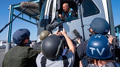 A truck driver picks up humanitarian aid designated for Gaza