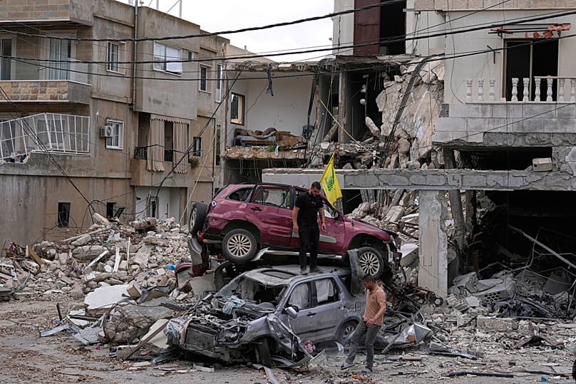 People check destroyed cars following a ceasefire between Israel and Hezbollah in the village of Maifadoun, southern Lebanon, Monday, June 22, 2026