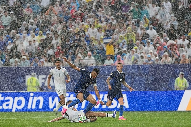 Iraq's Hussein Ali, bottom, challenges France's Kylian Mbappe during the World Cup Group I match in Philadelphia, Monday, June 22, 2026