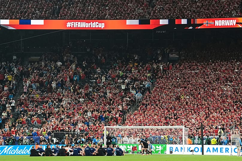 Norway's Martin Oedegaard bangs the drum as he the team salutes fans with a row chant after the World Cup Group I match against Senegal, Monday, June 22, 2026