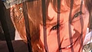 A banner with notes from hundreds of well-wishers for Nancy Guthrie, the missing mother of "Today" show host Savannah Guthrie, is displayed outside of KVOA Newsroom.
