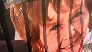 A banner with notes from hundreds of well-wishers for Nancy Guthrie, the missing mother of "Today" show host Savannah Guthrie, is displayed outside of KVOA Newsroom.