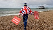 Anti Brexit campaigner Steve Bray walks on the beach to pose for a photograph during the Labour Party Conference at Brighton, England, 23 September, 2019. 