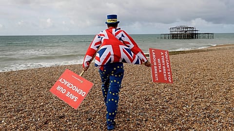 Anti Brexit campaigner Steve Bray walks on the beach to pose for a photograph during the Labour Party Conference at Brighton, England, 23 September, 2019. 