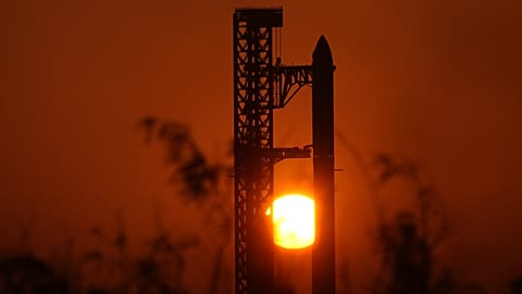 The sun rises behind SpaceX's mega rocket Starship as it is prepared for a test flight from Starbase, Texas, 22 May 2026