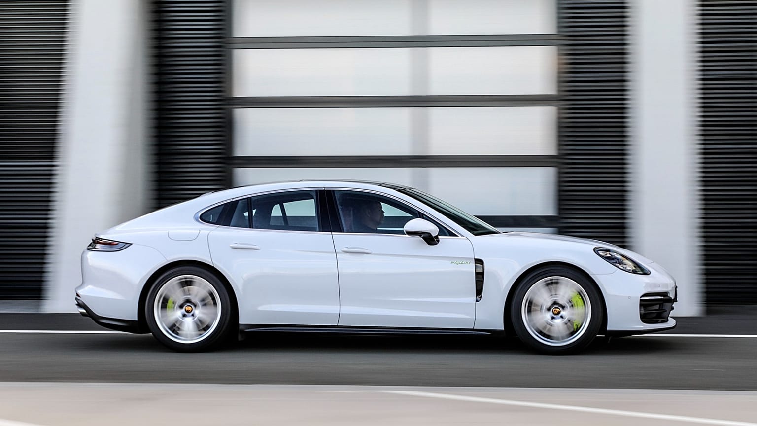 This photo provided by Porsche shows a 2020 Panamera. A plug-in hybrid version of a Panamera has less than 20 miles of all-electric range but fully delivers all of the refinem