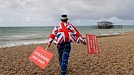 FILE. Anti Brexit campaigner Steve Bray walks on the beach to pose for a photograph during the Labour Party Conference at the Brighton Centre, England, Sept. 2019