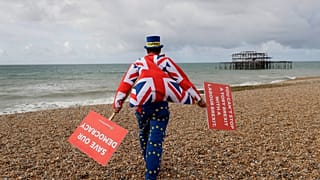 FILE. Anti Brexit campaigner Steve Bray walks on the beach to pose for a photograph during the Labour Party Conference at the Brighton Centre, England, Sept. 2019