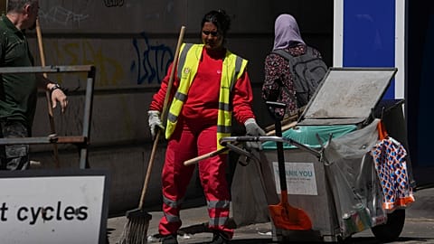 Street sweeper works in the sun in London, Tuesday, June 23, 2026, as a heat wave is predicted across Britain.