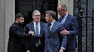 Ukraine's President Volodymyr Zelenskyy flanked by European leaders at 10 Downing Street, London, 8 December, 2025.