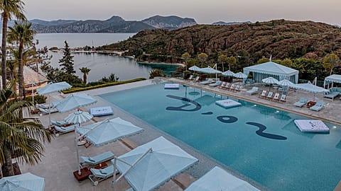 Designer brands are once again hosting beach club pop-ups this summer