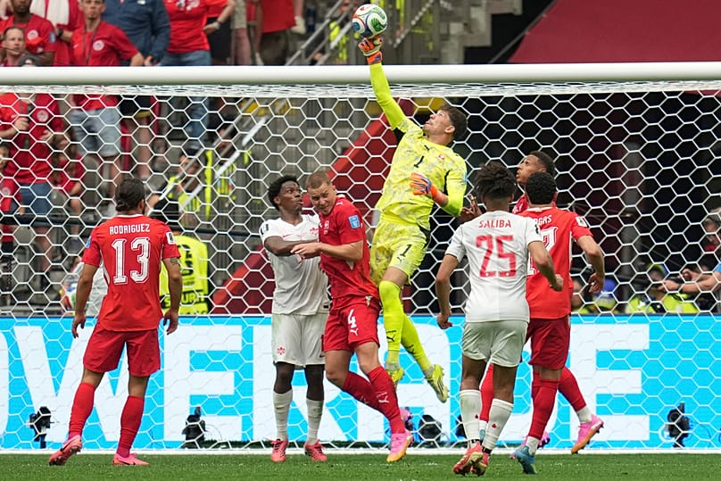 Switzerland goalkeeper Gregor Kobel jumps to make a save during the World Cup Group B match between against Canada in Vancouver, British Columbia, Wednesday, June 24, 2026