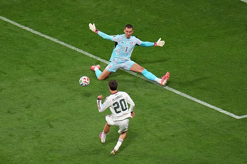 Mexico's Mateo Chavez scores their opening goal against Czechia goalkeeper Matej Kovar during the World Cup Group A match between in Mexico City, Wednesday, June 24, 2026