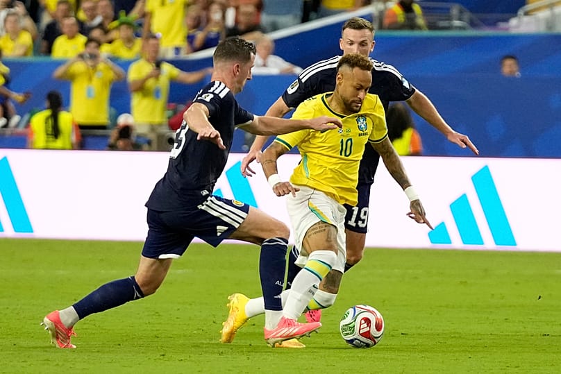 Brazil's Neymar challenges for the ball during the World Cup Group C match against Scotland in Miami Gardens, Florida, Wednesday, June 24, 2026