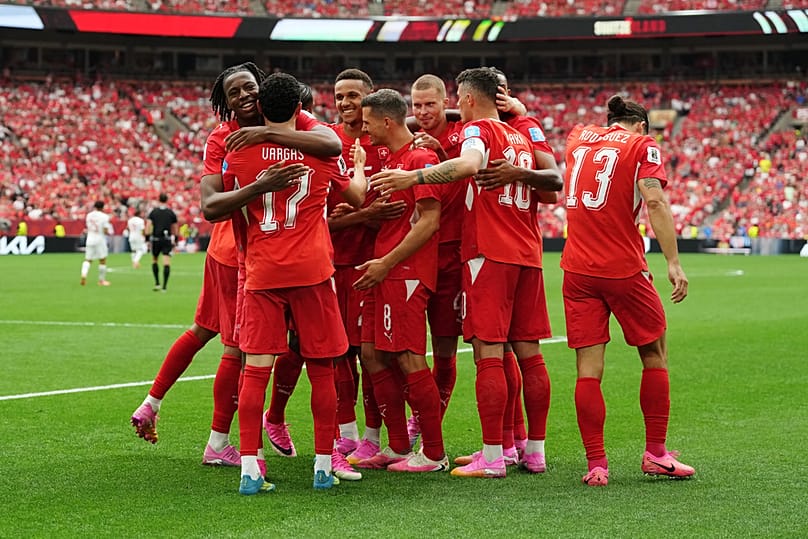 Switzerland's Ruben Vargas mobbed by teammates after scoring their first goal during the World Cup Group B match between against Canada in Vancouver, Wednesday, June 24, 2026