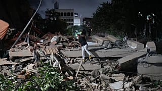 A man jumps on a collapsed building after an earthquake in Caracas, Venezuela, Wednesday, June 24, 2026