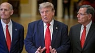 President Donald Trump, center, is joined by Sen. Rick Scott, R-Fla., left, and Sen. John Barrasso, R-Wyo., right, as he departs the Senate Steering Committee Lunch.