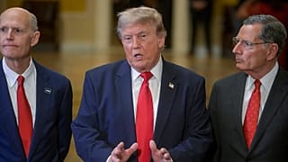 President Donald Trump, center, is joined by Sen. Rick Scott, R-Fla., left, and Sen. John Barrasso, R-Wyo., right, as he departs the Senate Steering Committee Lunch.