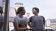 Amelie Kenney, right, and her partner Francesca Pilia stand on the balcony of the attic apartment they shares in Paris, Tuesday, June 23, 2026.