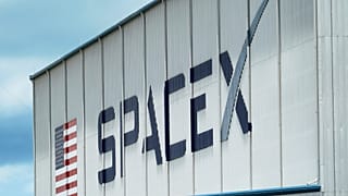 FILE - A SpaceX logo is displayed on a building on May 26, 2020, at the Kennedy Space Center in Cape Canaveral,