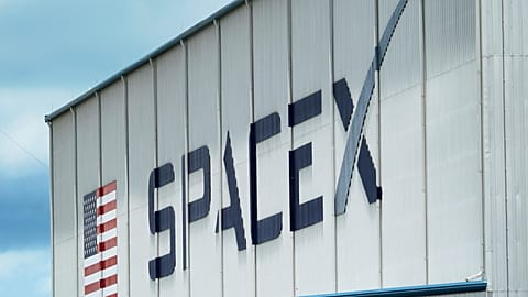 FILE - A SpaceX logo is displayed on a building on May 26, 2020, at the Kennedy Space Center in Cape Canaveral,