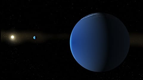 This illustration provided by NASA depicts the Sun-like star TOI-791, background left, and two giant planets that NASA's TESS space telescope discovered in its orbit.