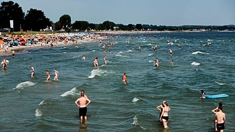 FILE: People spend the day at the beach of the Baltic Sea in Scharbeutz, northern Germany.