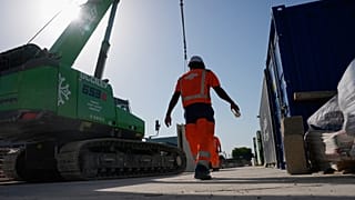 A worker on a construction site during high temperatures in Boulogne Billancourt, outside Paris, Wednesday, June 24, 2026.