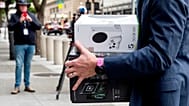 Xbox consoles are carried into a US federal courthouse in San Francisco as Microsoft defends its proposed takeover of Activision Blizzard. 28 June 2023.