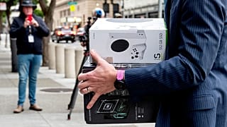 Xbox consoles are carried into a US federal courthouse in San Francisco as Microsoft defends its proposed takeover of Activision Blizzard. 28 June 2023.